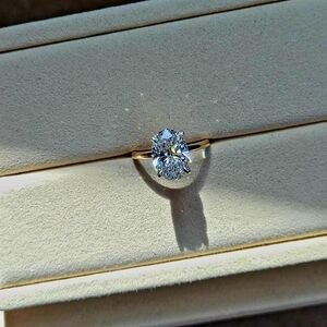 Platinum and 14k yellow gold 3ct E VVS2 lab oval diamond ring